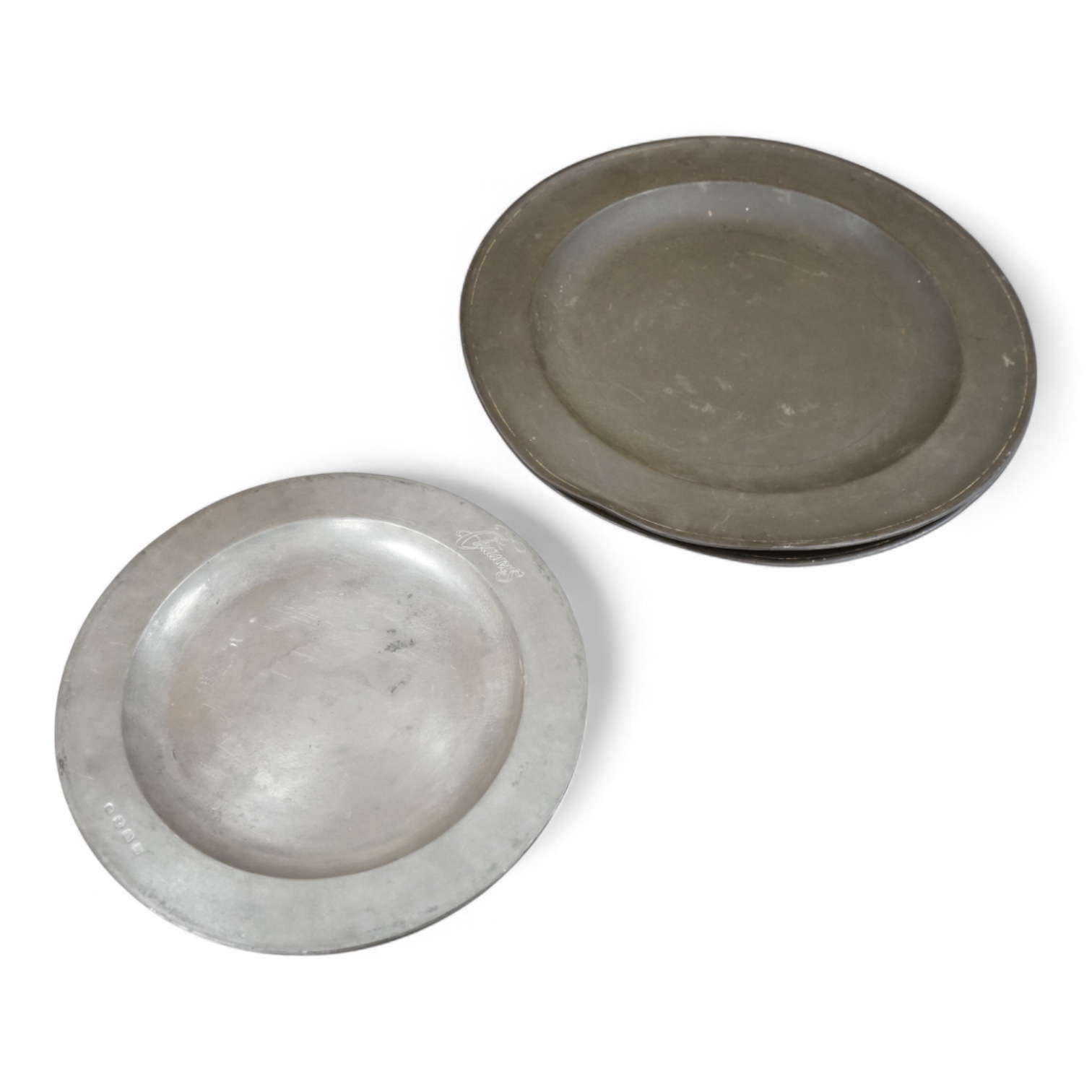 Two 19th century pewter chargers and a set of six pewter plates, largest 42cm in diameter